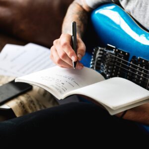 Caucasian man in a songwriting process