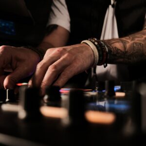 Closeup of a person playing songs and DJing - good for party-related categories