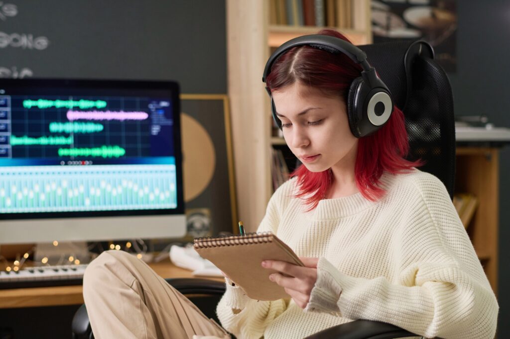 Creative teenage songwriter in studio